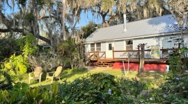 Back deck that faces West to the dock and sunset